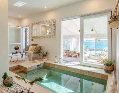 Villa Tramonto just steps from the beach, with a private path leading directly to the sea.